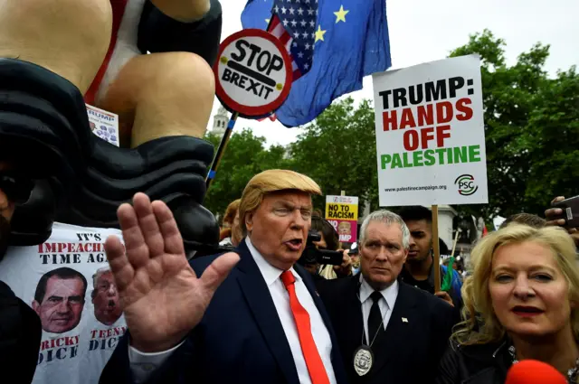 A man dressed as Donald Trump during the protests in central London