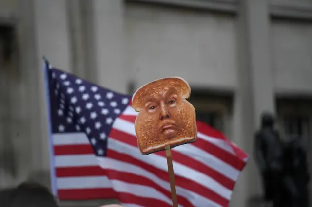 A protester holding a placard