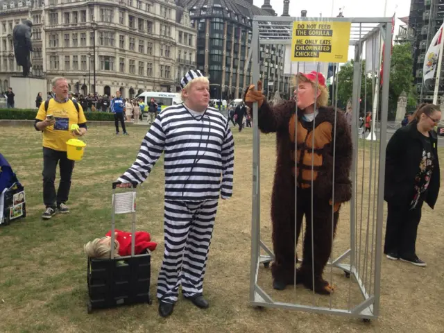 Protesters dressed as Boris Johnson and Donald Trump