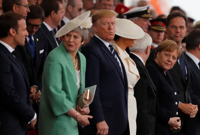 Macron, May and Trump watch the anniversary event unfold