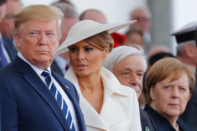 Donald and Melania Trump watch the show with German Chancellor Angela Merkel