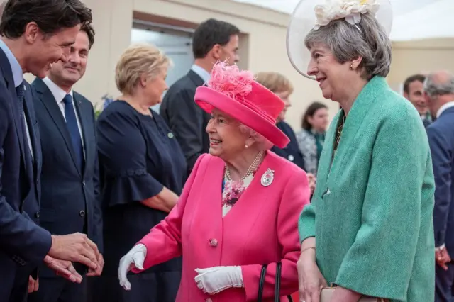 Prime Minister Theresa May, the Queen and Canada's Prime Minister Justin Trudeau