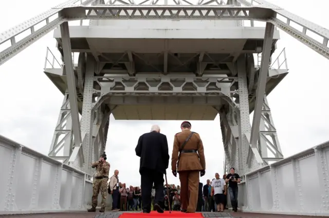 D-Day veteran John Eden walks on Pegasus Bridge