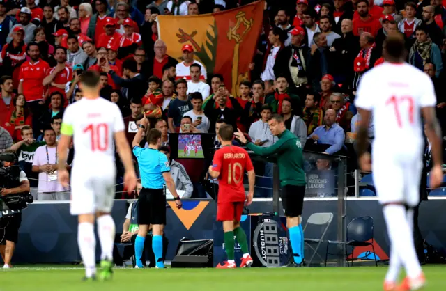 Referee checks VAR