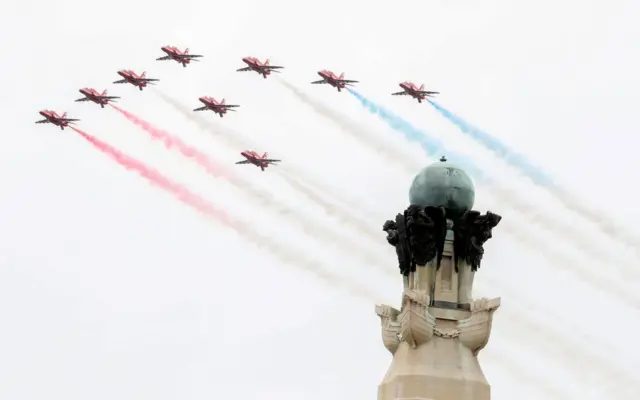 Red Arrows perform a flypast