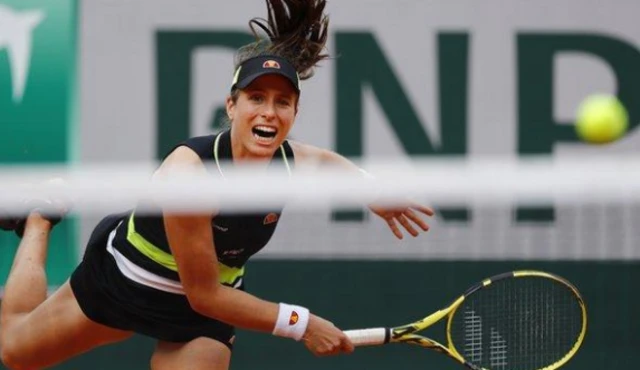 Konta serves