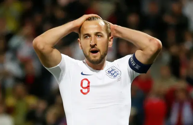 Harry Kane reacts to his shot