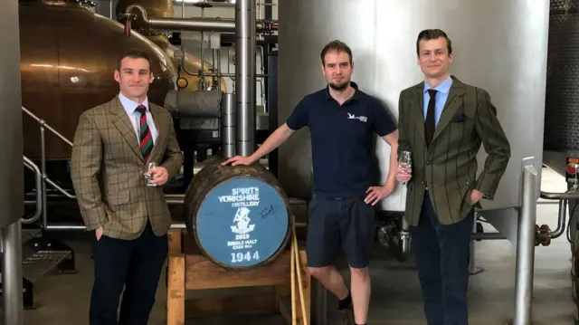 A pair of officers with the cask