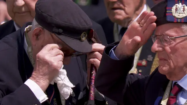 Veterans pay tribute to fallen servicemen at Bayeux war cemetery.