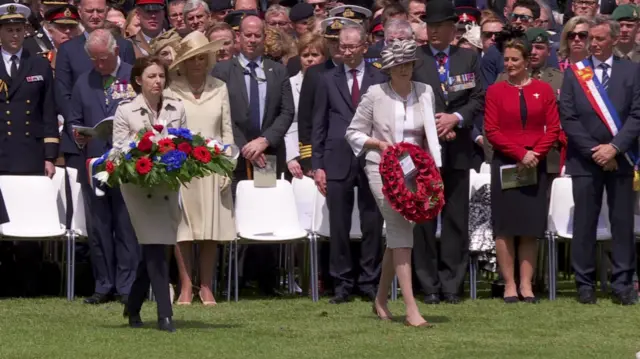 Theresa May and Florence Parly lay wreaths