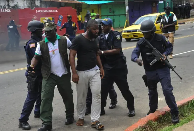 Demonstrators and police