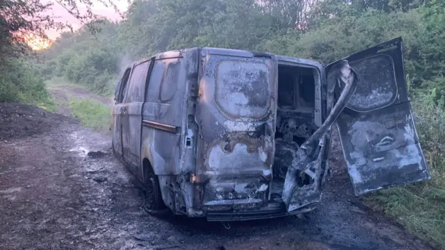 A burnt out van