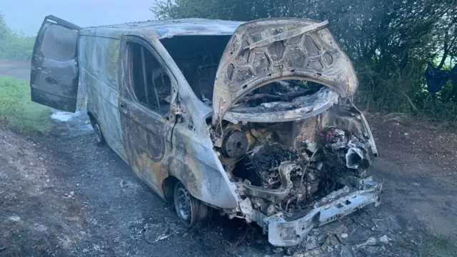 A burnt out van