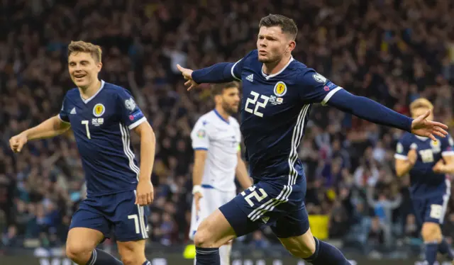 Oliver Burke celebrates his late winner for Scotland