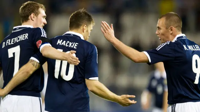 Darren Fletcher, Jamie Mackie and Kenny Miller celebrate