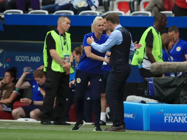 Phil Neville and Michelle Kerr shake hands at full time