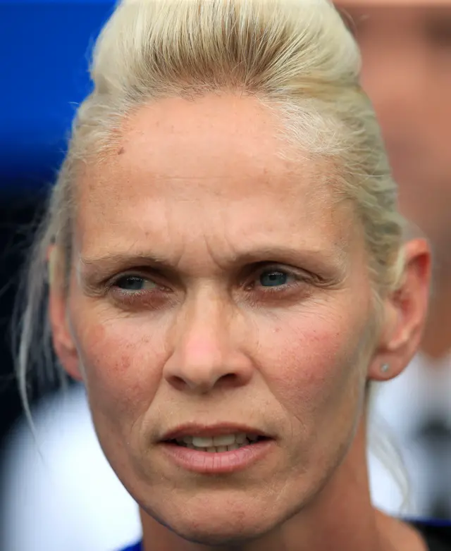 Shelley Kerr looks on