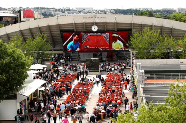 Deckchairs and a big screen outside the court at Roland Garros