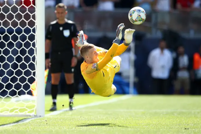 Jordan Pickford saves for England