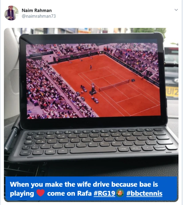 A tweet from Naim Rahman with a picture of the match on his laptop and the words 'When you make the wife drive because bae is playing. Come on Rafa'