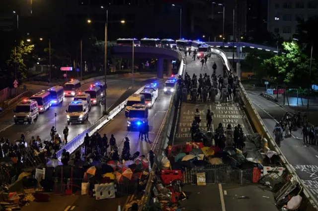 Police stand guard on roads in Hong Kong