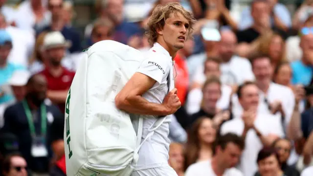 Alexander Zverev walks off court after losing to Jiri Vesely