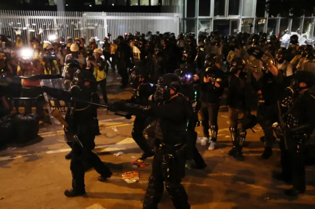 Riot police move in to disperse protesters in Hong Kong