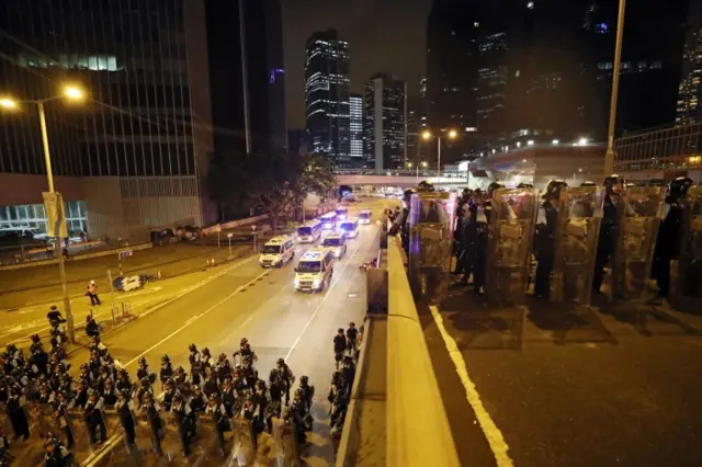 Riot police seal off the main roads in Hong Kong