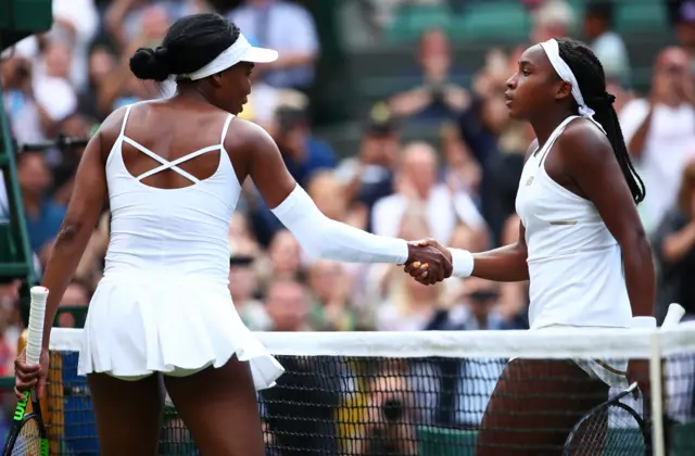 Cori Gauff shakes the hand of Venus Williams at the net