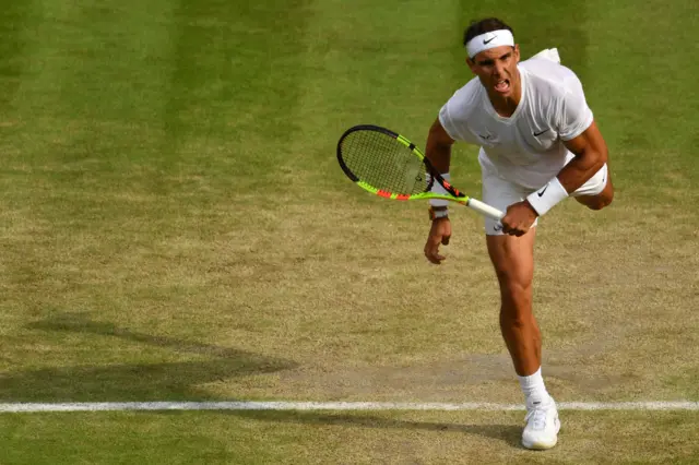 Rafael Nadal serves