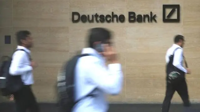 deutsche bank logo with people walking past