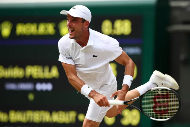 Roberto Bautista Agut serves