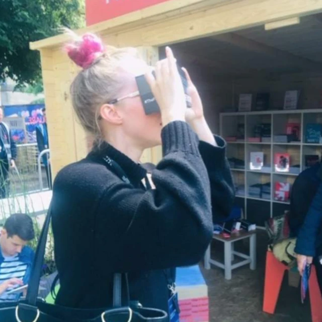 Tash wearing VR equipment and looking confused