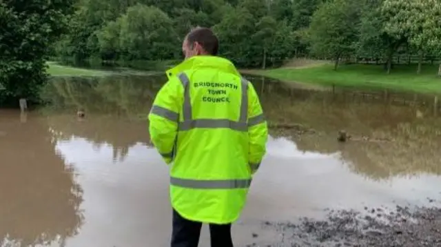 Man inspecting flooding