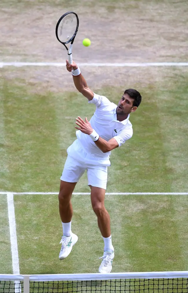 Novak Djokovic smashes home a volley