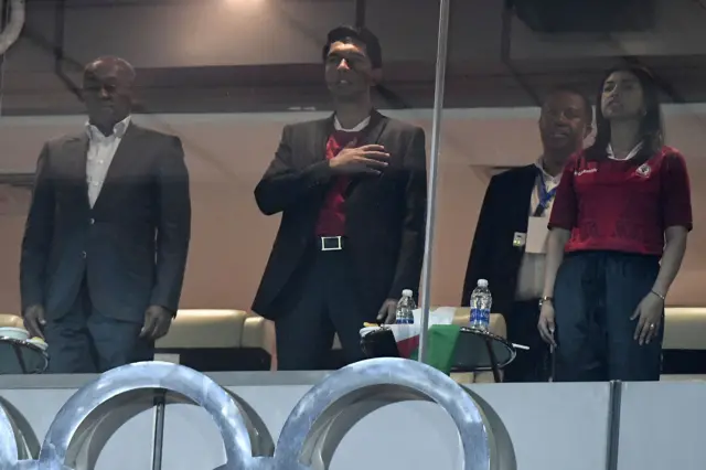 Madagascar"s president Andry Rajoelina (C) and his wife Mialy Rajoelina (R) attend the 2019 Africa Cup of Nations (CAN) quarter final football match between Madagascar and Tunisia