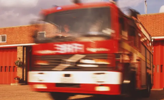 Fire engine leaving fire station