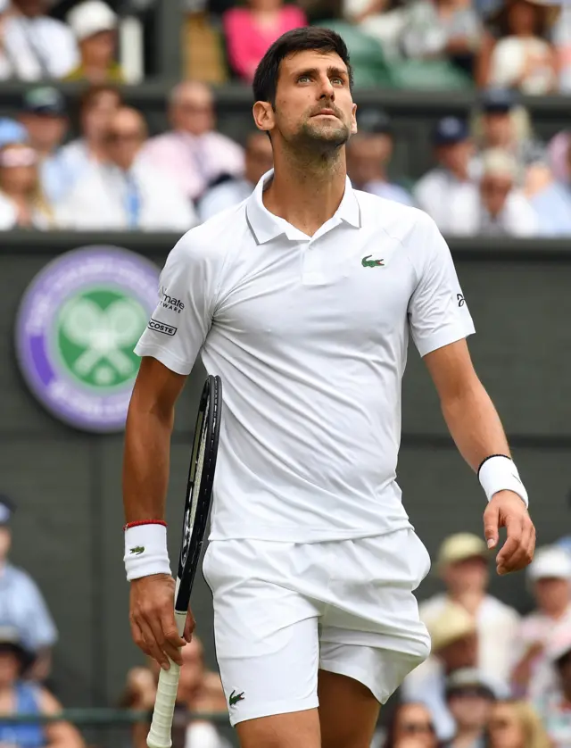 Novak Djokovic reacts after being broken for the first time in this match