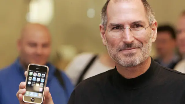 Steve Jobs with the first iPhone in 2007