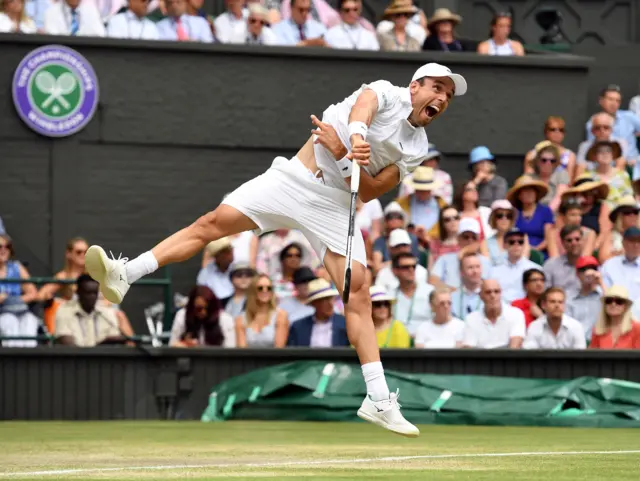 Roberto Bautista Agut serves