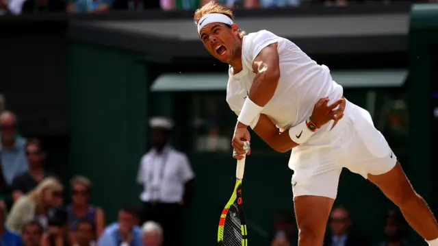 Rafael Nadal serves