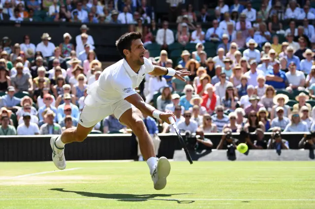 Novak Djokovic chases down a shot