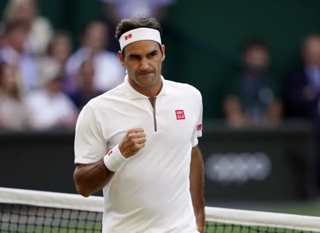 Roger Federer pumps his fist