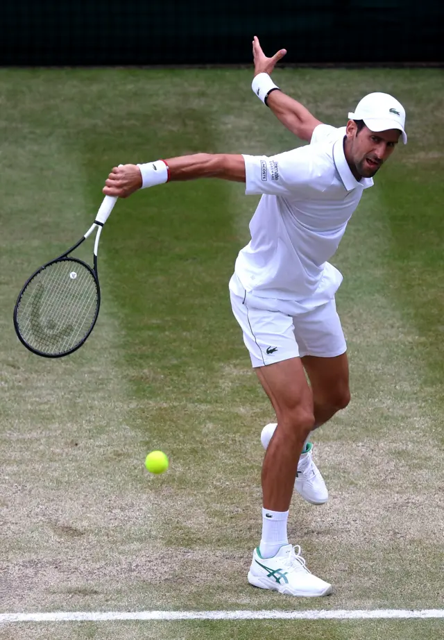 Novak Djokovic slices the ball