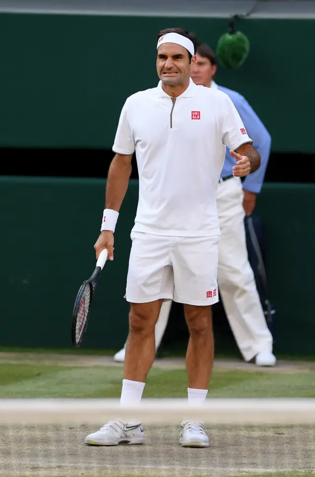 Roger Federer makes a bad call for a review on a Rafael Nadal serve