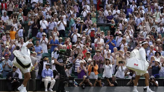 Roger Federer of Switzerland (R) and Rafael Nadal