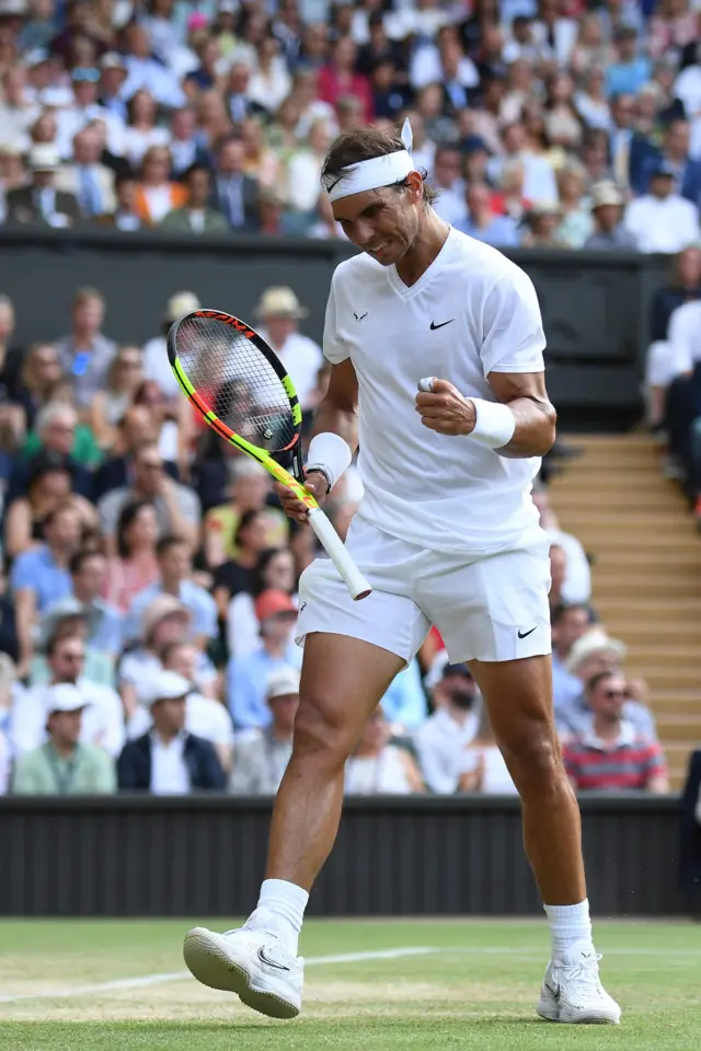 Rafael Nadal holds his serve