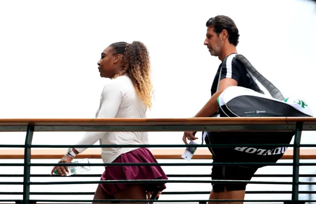 Serena Williams and her coach Patrick Mouratoglou arrive ahead of the women's singles final.