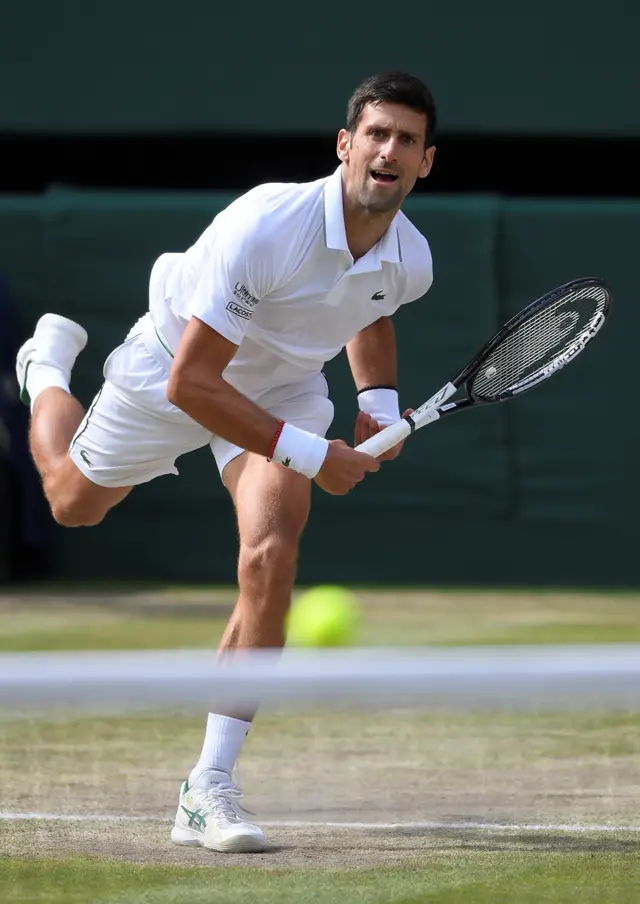 Novak Djokovic serves