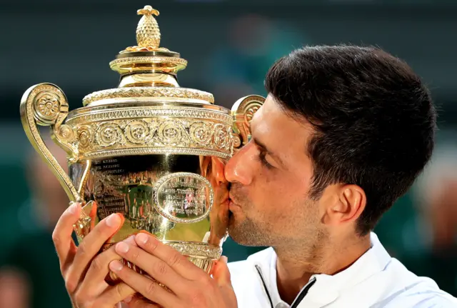 Novak Djokovic kisses the trophy